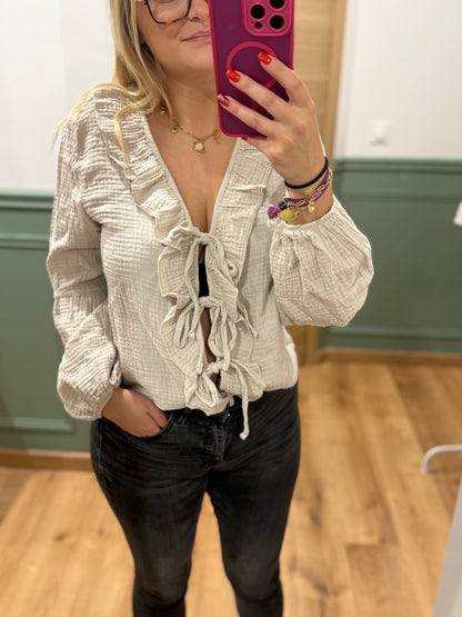 Blouse à volants et lien noué