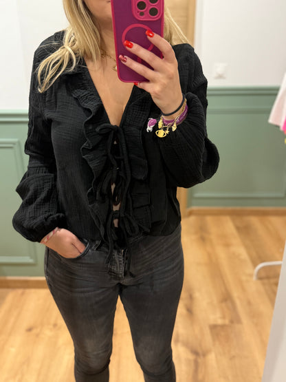 Blouse à volants et lien noué