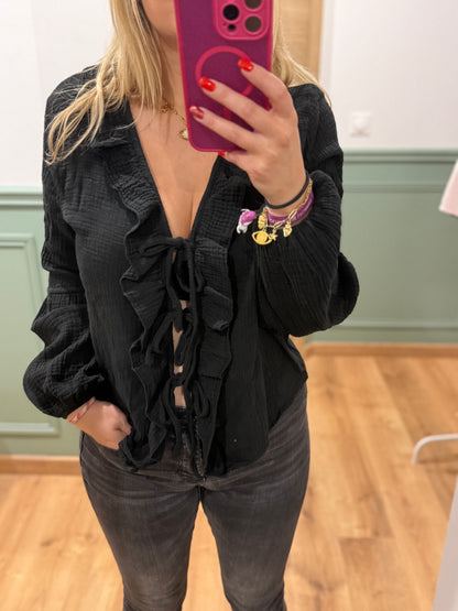 Blouse à volants et lien noué