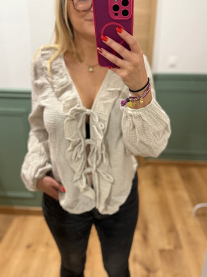 Blouse à volants et lien noué