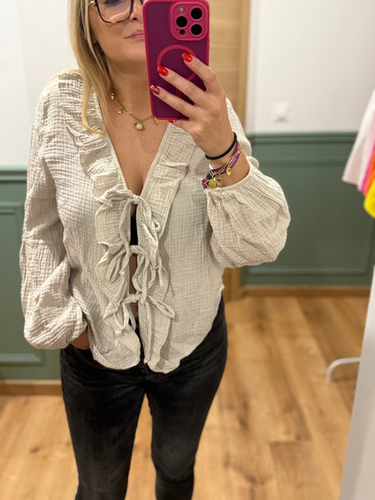 Blouse à volants et lien noué